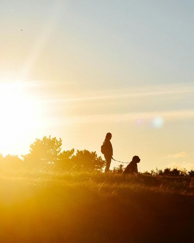 Woman performing visual relaxation exercise at sunset